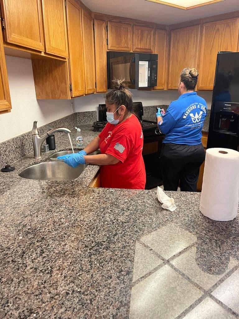 Warriors of the Order crew deep cleaning a kitchen