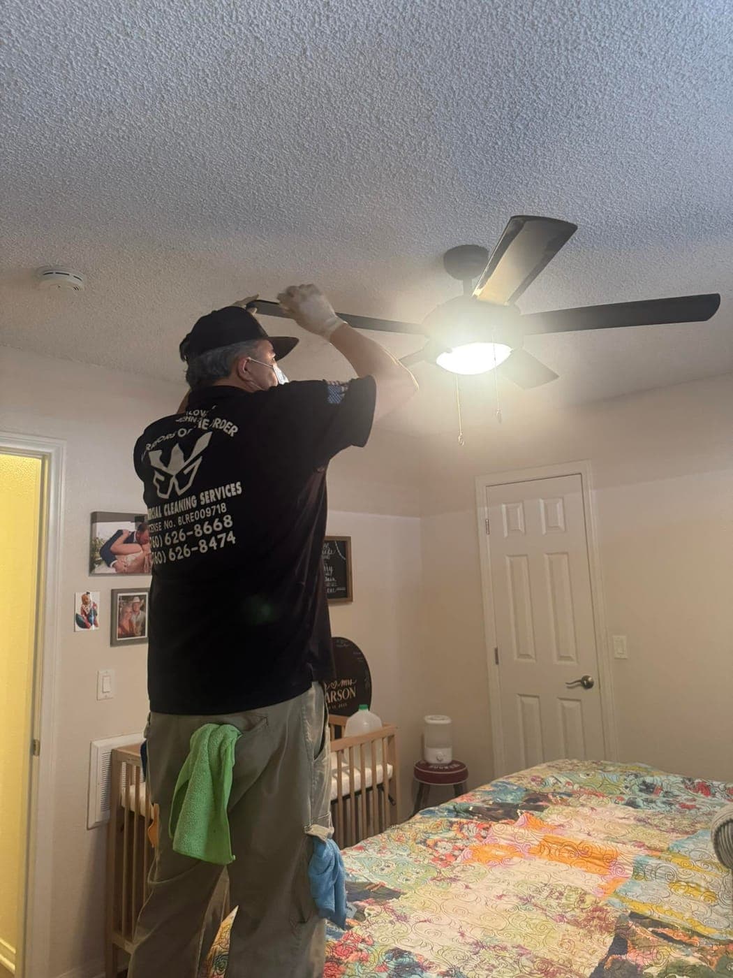 A Warriors of the Order cleaner detailing ceiling fan blades in a North County home