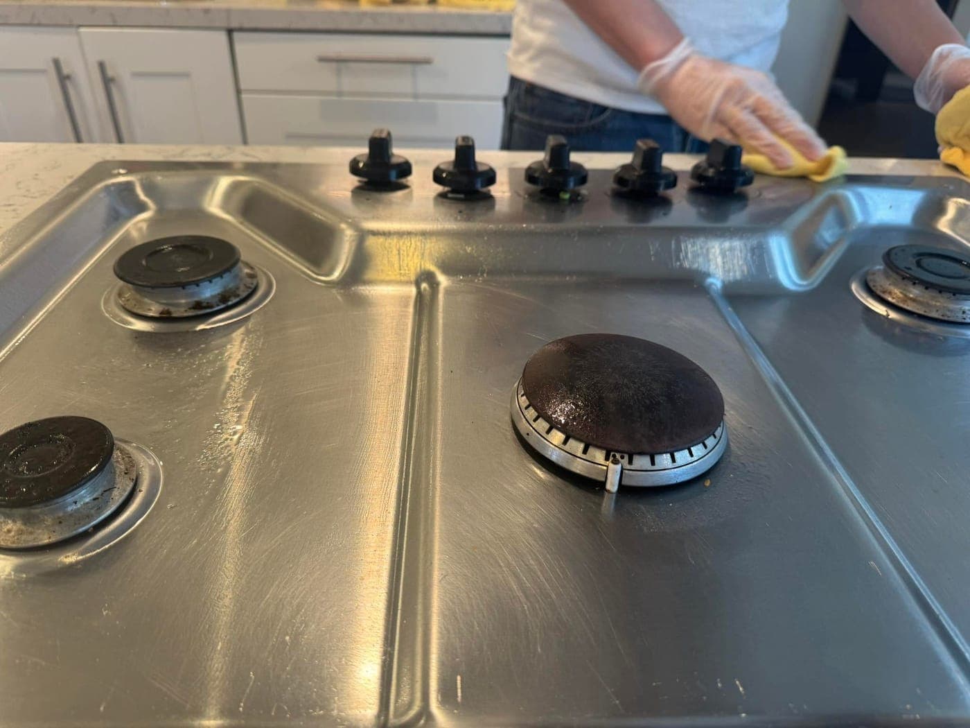 A degreased stovetop after a Warriors of the Order kitchen clean