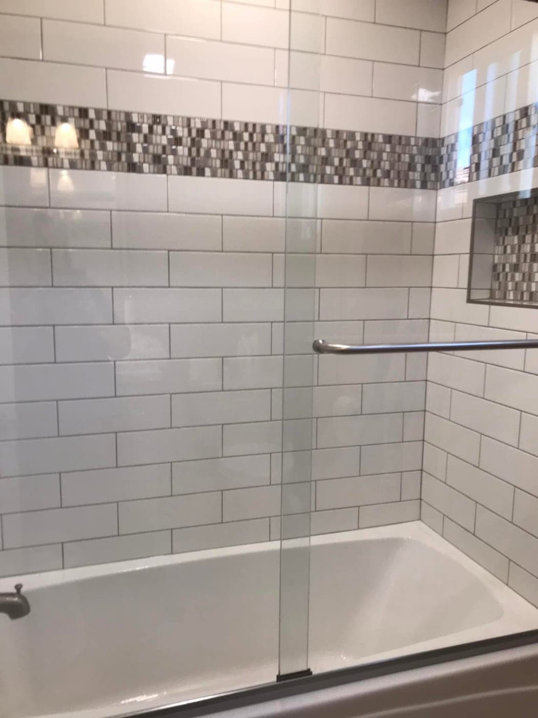A spotless tiled shower cleaned by Warriors of the Order